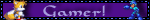 A blinkie with a dark and light purple flashing border and a purple background. It has a sprite of Tails from the Sonic series on the left and a sprite of Mega Man from Mega Man on the right, and the text in the center reads "Gamer!" in a medieval-looking font.